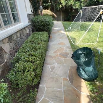 SemoPro - a stone walkway in front of a house - Landscaping Near Me