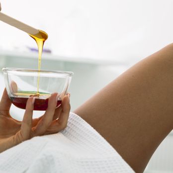 Care Boutique & Salon - Body Waxing-Beautician prepares wax for a beauty treatment - Waxing Near Me - Richardson, Texas Care Boutique & Salon - Body Waxing-Beautician prepares wax for a beauty treatment - Waxing Near Me - Richardson, Texas