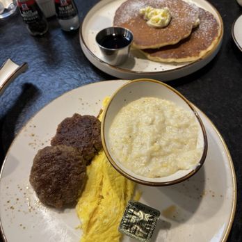 Miam Breakfast House - Combo of the day with sausage, scrambled eggs, grits and pancakes - Breakfast & Brunch Near Me - Greensboro, North Carolina Miam Breakfast House - Combo of the day with sausage, scrambled eggs, grits and pancakes - Breakfast & Brunch Near Me - Greensboro, North Carolina