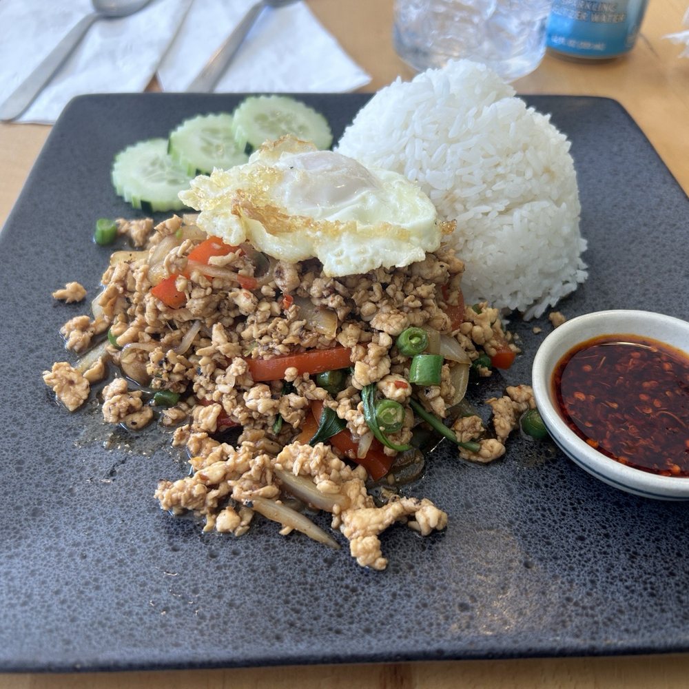 Pad Krapow (Spicy Thai Basil w/ ground chicken and a fried egg). Extra spice on the side. Pad Krapow (Spicy Thai Basil w/ ground chicken and a fried egg). Extra spice on the side.