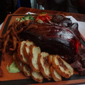 Radiator Whiskey - pig head feast - New American Near Me - Seattle, Washington