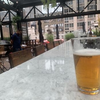 Refinery Rooftop - When you travel by yourself you do a lot of portrait shots of your alcoholic beverages. - Lounges Near Me - New York, New York