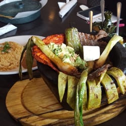 La Donita - Cactus comes in a stone pot with pork n steak guacamole and a cube of tofu iv gotta say it's delicious