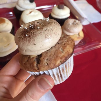 Layers - a hand holding a cupcake with frosting and sprinkles - Bakeries Near Me - Halifax, Nova Scotia Layers - a hand holding a cupcake with frosting and sprinkles - Bakeries Near Me - Halifax, Nova Scotia