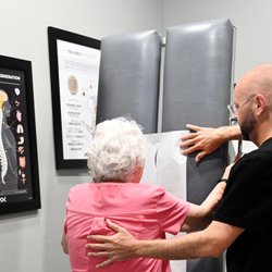 AlignOK Chiropractic Wellness - Dr. Brotherton performing an exam at his chiropractic clinic in South Oklahoma City, OK.