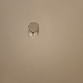 Shugarman's Bath - Hole in our bathroom door from the install. - General Contractors Near Me - San Diego, California