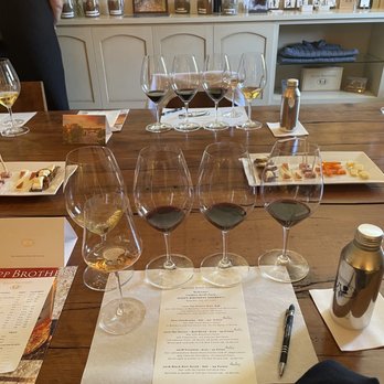 Krupp Brothers Tasting Room - wine glasses on a table - Wine Tasting Room Near Me - Napa, California Krupp Brothers Tasting Room - wine glasses on a table - Wine Tasting Room Near Me - Napa, California