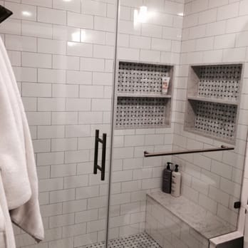 The Fix It Chick - After: built-in shelves, custom shower with bench. - Interior Design Near Me