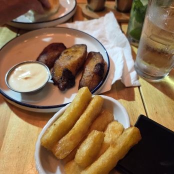 La Parrilla Broadway - Patacones (Tostones) / Green Plantains Yuca Frita / Fried Cassava - Colombian Near Me - Chicago, Illinois La Parrilla Broadway - Patacones (Tostones) / Green Plantains Yuca Frita / Fried Cassava - Colombian Near Me - Chicago, Illinois