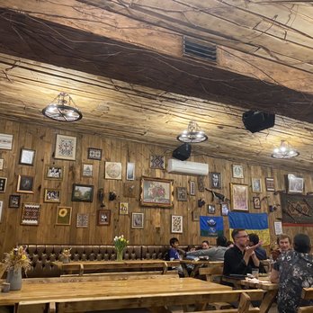Barrel House Korchma - Rustic decor and bench seating - Ukrainian Near Me - Toronto, Ontario