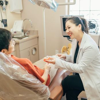 Prime Dental - Tucson dentist Dr. Sarah Kym explaining dental implants to patient at Prime Dental - General Dentistry Near Me - Tucson, Arizona Prime Dental - Tucson dentist Dr. Sarah Kym explaining dental implants to patient at Prime Dental - General Dentistry Near Me - Tucson, Arizona