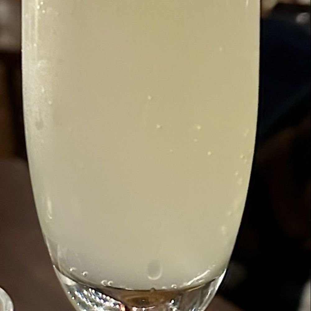 Table Mesa - Their version of a French 75 - Latin American Near Me - Bentonville, Arkansas Table Mesa - Their version of a French 75 - Latin American Near Me - Bentonville, Arkansas
