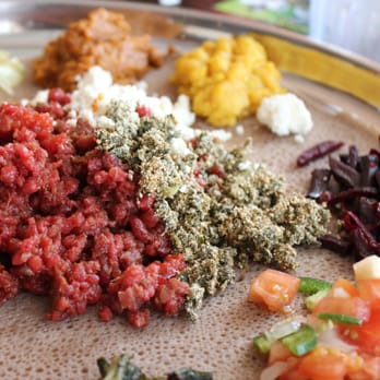 Ibex Ethiopian Restaurant - Kitfo is the steak tartare of Ethiopia, the gomen kitfo is the greens with cheese to the right, and delicious beets. - Ethiopian Near Me - Takoma Park, Maryland Ibex Ethiopian Restaurant - Kitfo is the steak tartare of Ethiopia, the gomen kitfo is the greens with cheese to the right, and delicious beets. - Ethiopian Near Me - Takoma Park, Maryland