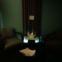 In the spa waiting room, mood lighting and comfy chairs await