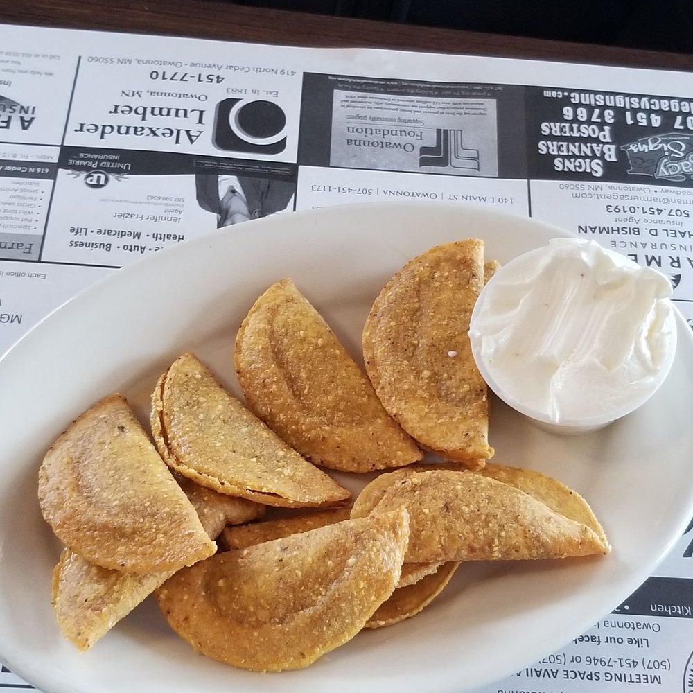 The Kitchen - a plate of nachos with sour cream - American Near Me - Owatonna, Minnesota The Kitchen - a plate of nachos with sour cream - American Near Me - Owatonna, Minnesota
