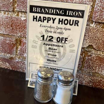 Branding Iron - two salt and pepper shakers on a table - American Near Me - Casper, Wyoming