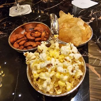 Petrossian Bar - Table snack, lays potato chips, popcorn and candied almonds. - Lounges Near Me - Las Vegas, Nevada