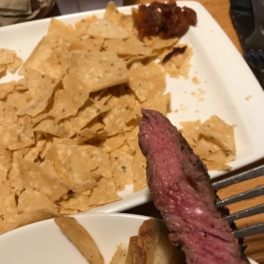 Applebee's Grill + Bar - Way under cooked meat, smooshed chips and the random stuff in the corner is what the other person found in their food. - American Near Me - Green Bay, Wisconsin