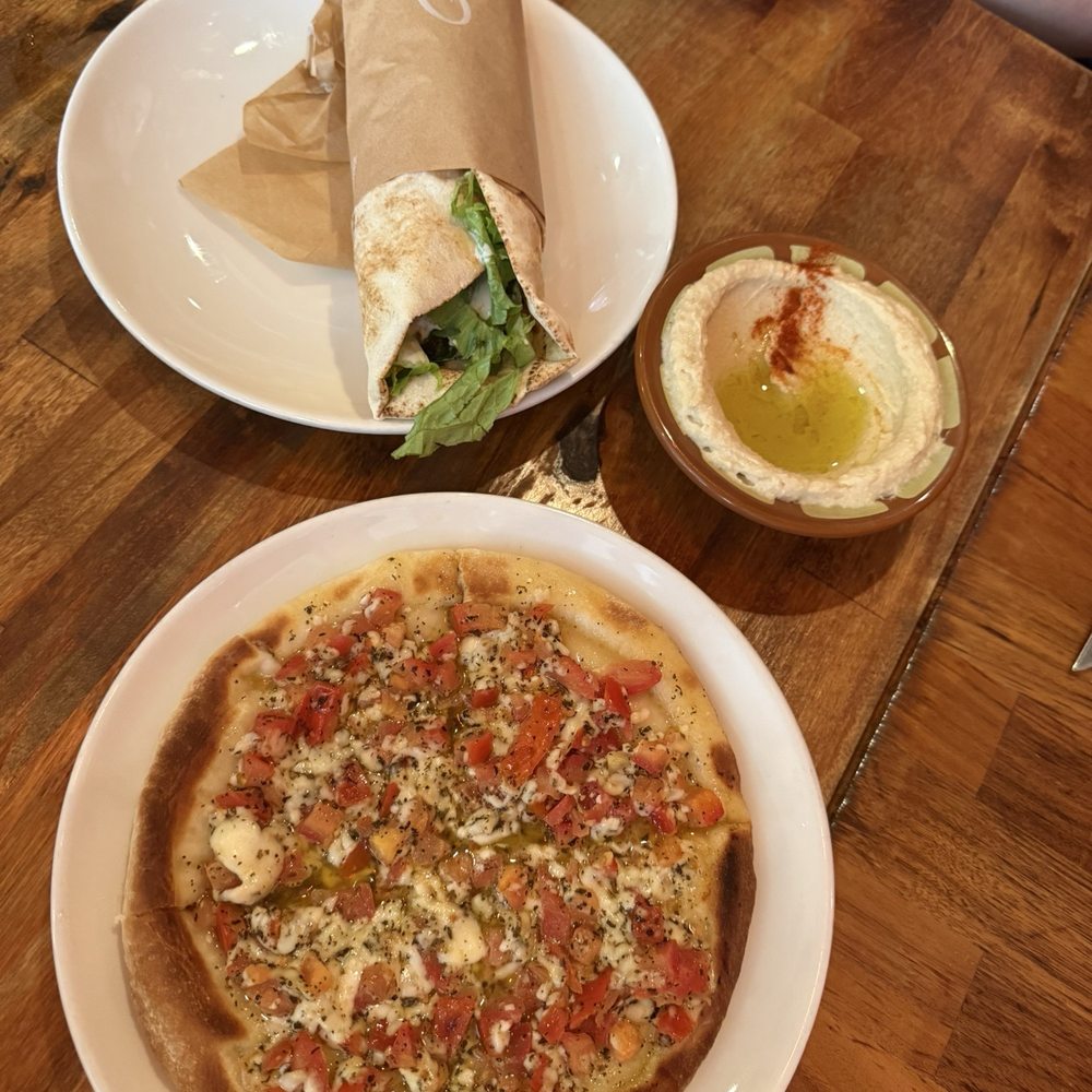 Yassmina vg Pizza, and the Falafel vn Pita Sandwich lunch special with hummus for the side. Yassmina vg Pizza, and the Falafel vn Pita Sandwich lunch special with hummus for the side.