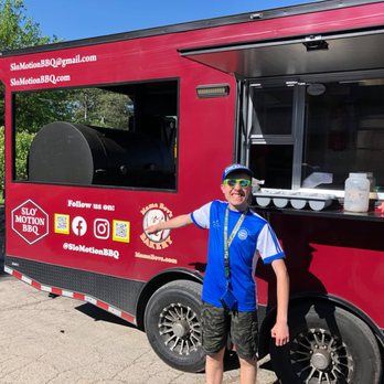 Slo Motion BBQ - a man standing in front of a food truck - Food Trucks Near Me - Sussex, Wisconsin