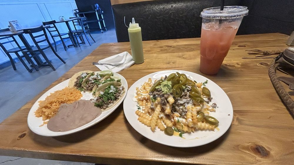 Vaqueros Over the Fire Logo