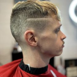 High Energy Barber - Five profile of a taper fade with a hard line part