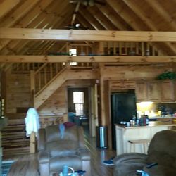 The Log Knest - Second level, looking south. The stairs go to the loft up top. Master BR straight ahead.