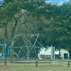 Scarborough Square Park - Climbing structure and a partial view of some of the swings