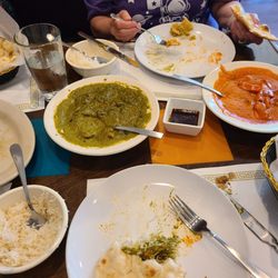 Green is saag chicken and orange is butter chicken, my favorite.