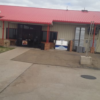 Chisum Travel Center - a car parked in front of a building - Gas Stations Near Me - San Jon, New Mexico