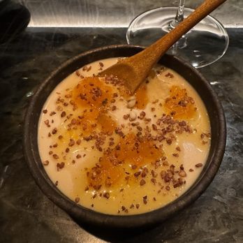 Coral Omakase - a bowl of soup with a wooden spoon - Sushi Bars Near Me - New York, New York