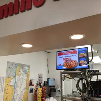 Domino's Pizza - a man standing in front of a tv - Pizza Near Me - Enfield, Connecticut Domino's Pizza - a man standing in front of a tv - Pizza Near Me - Enfield, Connecticut