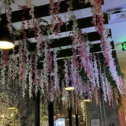 Decor on the ceiling that looks like the edible plants used in the drinks. Decor on the ceiling that looks like the edible plants used in the drinks.
