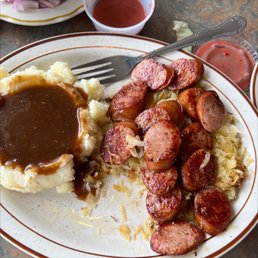 a plate of sausage and mashed potatoes a plate of sausage and mashed potatoes