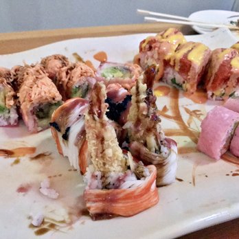 Sake Asian - Back left golden spider roll, back right pink lady roll, front left black angel roll, front right x-mas roll. - Asian Fusion Near Me - West Babylon, New York Sake Asian - Back left golden spider roll, back right pink lady roll, front left black angel roll, front right x-mas roll. - Asian Fusion Near Me - West Babylon, New York