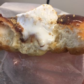 Jelly Modern Doughnuts - a half eaten doughnut - Donuts Near Me - Calgary, Alberta