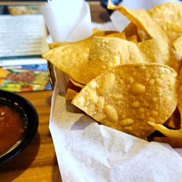 Warm, thin-style chips and mild salsa. Warm, thin-style chips and mild salsa.