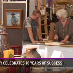 The Frame Gallery - Greta (owner) and Thomas (manager) discussing framing options. We recently celebrated ten years of First Friday's in Downtown Bryan, Texas.