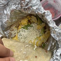El Portal Maya - Breakfast Burrita de Maiz - Corn tortilla with beans, cheese, cream and egg. With green picante sauce and some pickled toppings on the side.