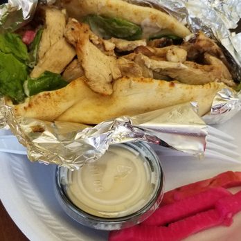 Waffa's Kitchen - Chicken shawrma sandwich with lots of chicken and tahini sauce and pickles. - Mediterranean Near Me - Glendora, California Waffa's Kitchen - Chicken shawrma sandwich with lots of chicken and tahini sauce and pickles. - Mediterranean Near Me - Glendora, California