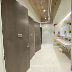 Eagan Art House - Single stall all-gender restrooms in fun colors