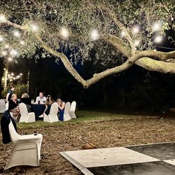 Grove Indian Pass - We put the dance floor by the tower, hung lights and a handmade chandelier in the Oak tree.