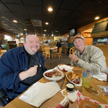 Rico's Cafe & Pizzeria - Boys eating boneless wings and onion rings!! - Pizza Near Me - Grawn, Michigan