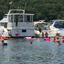 Party Cove Charters - The Nimis in party cove, in a mooring line with other boats.