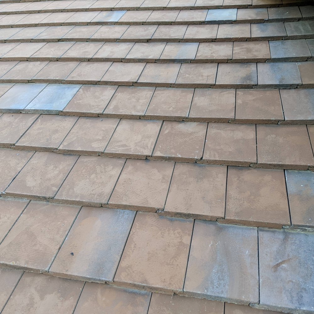 Colin Roofing - The roof was a consistent color before we hired this company.  But this was the end result, mismatched replacement tiles. - Roofing Near Me - Palmdale, California