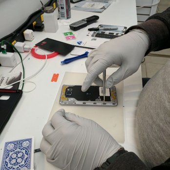 Mobile Fix NYC - Carefully opening up a cracked screen Samsung. - Mobile Phone Repair Near Me - Westbury, New York
