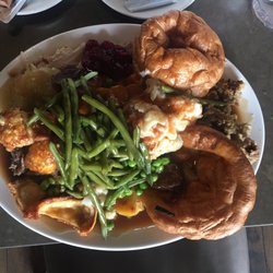 Toby Carvery - Todays carvery helping,, 2 yorkie pudds also!! The veg is piled on top of my beef turkey and pork.. all was warm and delicious