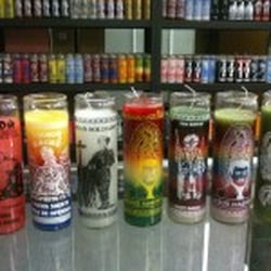 Many sorts of candles of Saints from around the world.