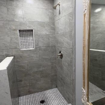 The Legacy Group - a walk - in shower with a shower head - General Contractors Near Me - East Hanover, New Jersey The Legacy Group - a walk - in shower with a shower head - General Contractors Near Me - East Hanover, New Jersey