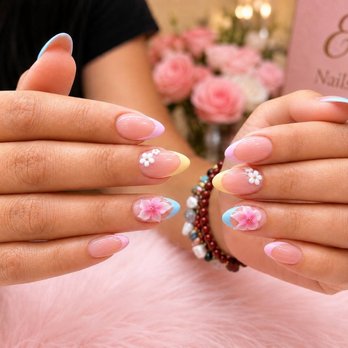 Ely Nails & Spa - Soft pink French tips with delicate 3D floral designs - fresh, feminine, and handcrafted at Ely Nails & Spa - Nail Salons Near Me - Sevierville, Tennessee Ely Nails & Spa - Soft pink French tips with delicate 3D floral designs - fresh, feminine, and handcrafted at Ely Nails & Spa - Nail Salons Near Me - Sevierville, Tennessee